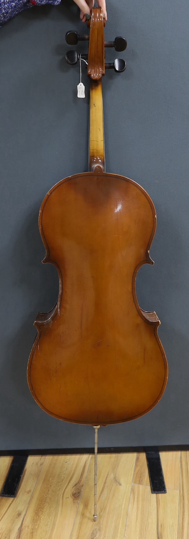 A modern cello, with canvas case